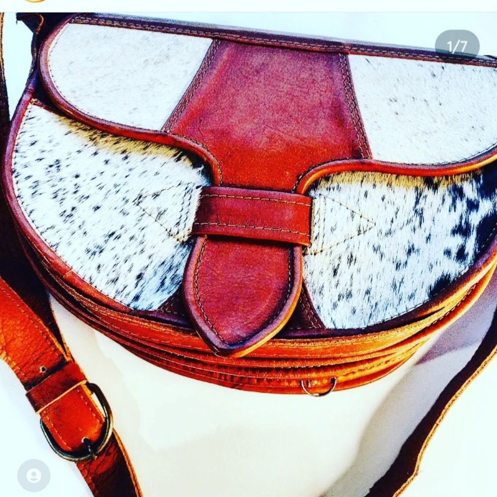 Artisan made leather crossbody with secret zip pocket